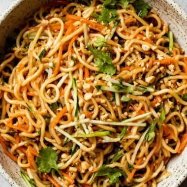 Delicious Asian cold noodle salad with fresh vegetables and sesame dressing
