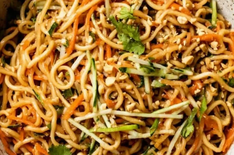 Delicious Asian cold noodle salad with fresh vegetables and sesame dressing