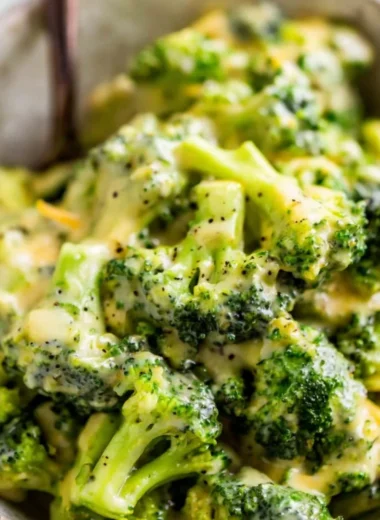 Delicious cheesy broccoli dish with melted cheese and fresh broccoli florets.
