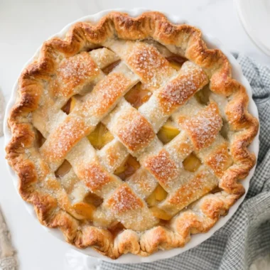 Delicious homemade apple pie with golden crust and fresh apples