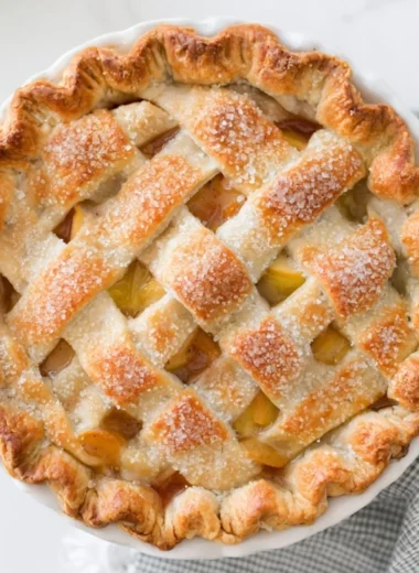 Delicious homemade apple pie with golden crust and fresh apples