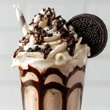 Delicious Bailey's Cookies and Cream Shake with whipped cream and cookie crumbs