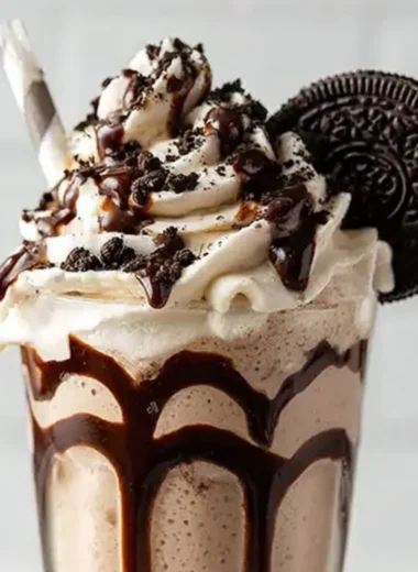 Delicious Bailey's Cookies and Cream Shake with whipped cream and cookie crumbs