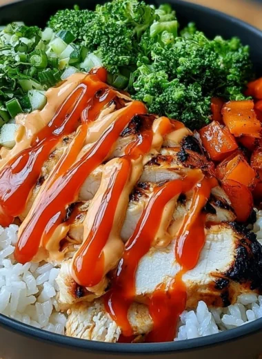 Bang Bang Chicken Bowl featuring a mix of vibrant ingredients and sauces.