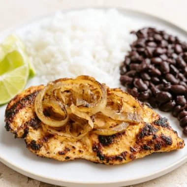 Delicious Cuban Grilled Chicken served with fresh vegetables and grilled garnish.