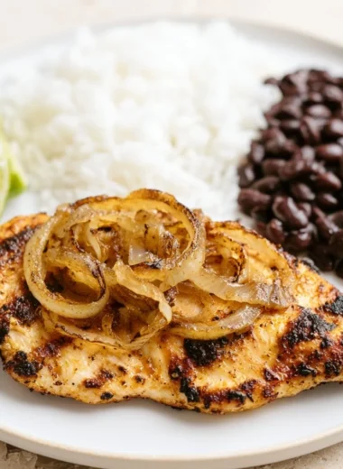 Delicious Cuban Grilled Chicken served with fresh vegetables and grilled garnish.