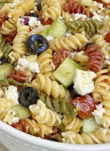 Bowl of easy Italian pasta salad with fresh vegetables and dressing