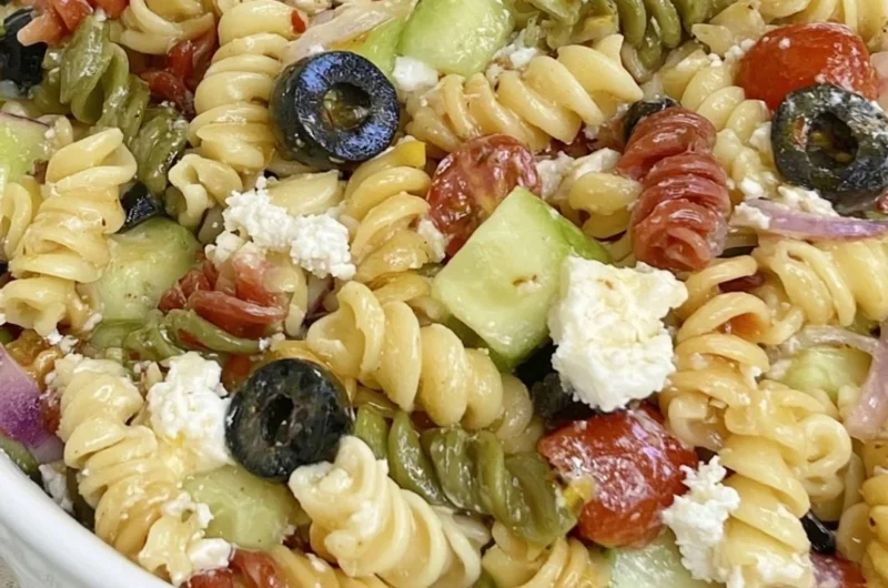 Bowl of easy Italian pasta salad with fresh vegetables and dressing