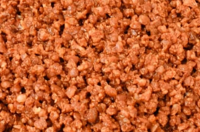 Bowl of easy lentil taco meat served in taco shells with toppings