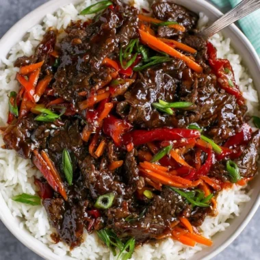 Delicious easy Mongolian beef served with rice and vegetables