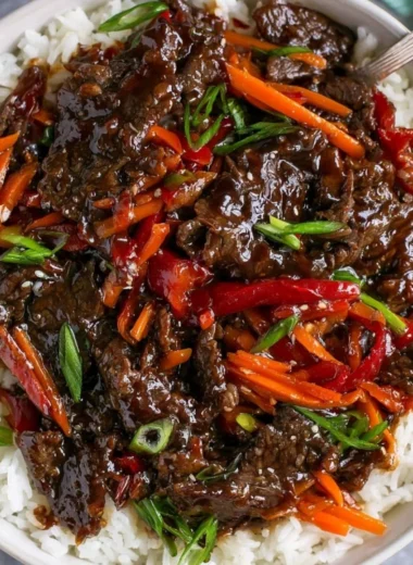 Delicious easy Mongolian beef served with rice and vegetables