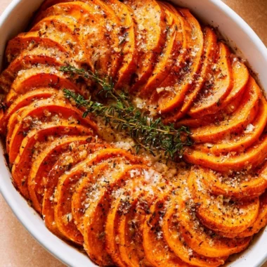 Delicious Garlic Parmesan Roasted Sweet Potatoes served on a plate.