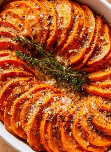Delicious Garlic Parmesan Roasted Sweet Potatoes served on a plate.