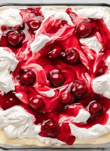 Heaven on Earth Cake served with whipped cream and fresh berries