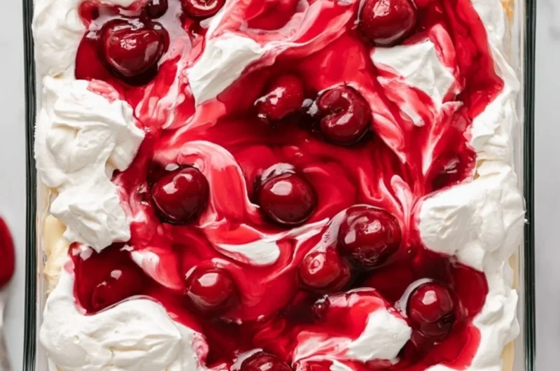 Heaven on Earth Cake served with whipped cream and fresh berries