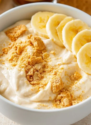 High Protein Banana Pudding Bowl with bananas and creamy layers