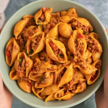 High protein taco pasta dish with toppings served in a bowl