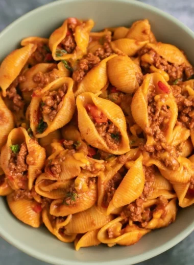 High protein taco pasta dish with toppings served in a bowl