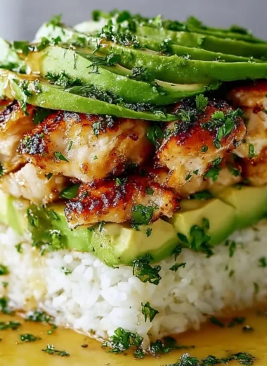 Honey Lime Chicken Avocado Rice Stack served in a colorful bowl