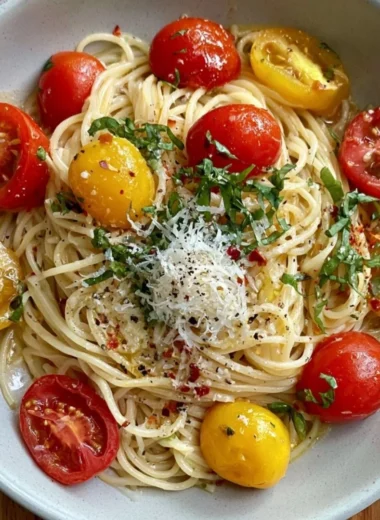 Delicious summer garden pasta inspired by Ina Garten's recipe, featuring fresh vegetables.