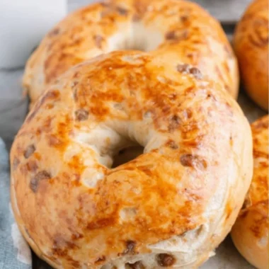 Delicious baked Maple French Toast Bagels topped with syrup and butter.