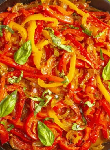 Bowl of pepper stew with colorful vegetables and herbs