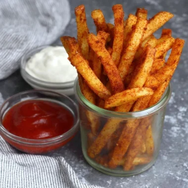Bowl of homemade Popeyes Cajun Fries seasoned and crispy