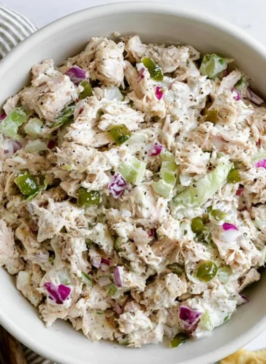 Delicious rotisserie chicken salad with fresh vegetables and dressing
