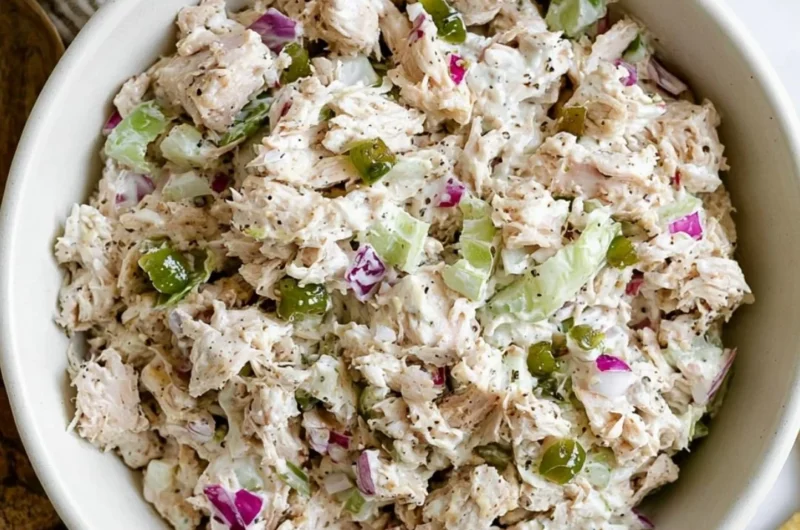 Delicious rotisserie chicken salad with fresh vegetables and dressing