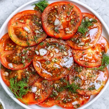 Freshly made simple tomato salad with vibrant colors and ingredients