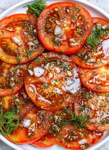 Freshly made simple tomato salad with vibrant colors and ingredients