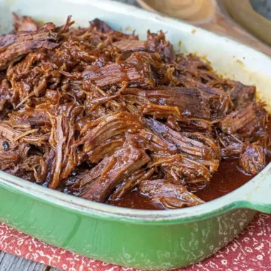 Texas Cola Shredded Beef Brisket served on a plate with garnishes