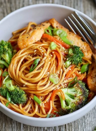 15-minute chicken stir fry noodles dish with colorful vegetables