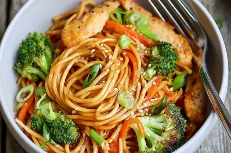 15-minute chicken stir fry noodles dish with colorful vegetables