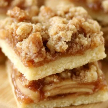 Delicious Apple Crisp Shortbread Bars topped with a crispy oat topping.