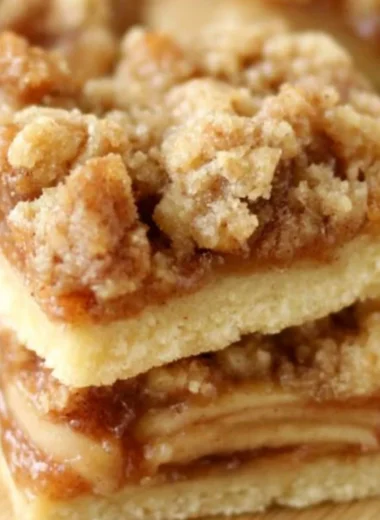 Delicious Apple Crisp Shortbread Bars topped with a crispy oat topping.