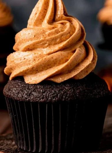 Delicious homemade chocolate pumpkin cupcakes with creamy frosting.