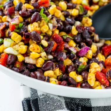 Fresh Corn Salsa made with corn, tomatoes, and herbs in a bowl