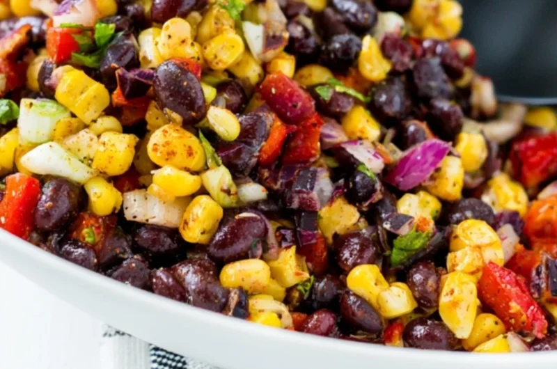 Fresh Corn Salsa made with corn, tomatoes, and herbs in a bowl