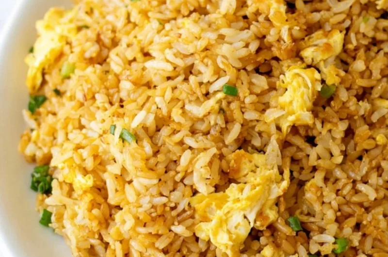 Delicious easy fried rice dish garnished with vegetables and egg