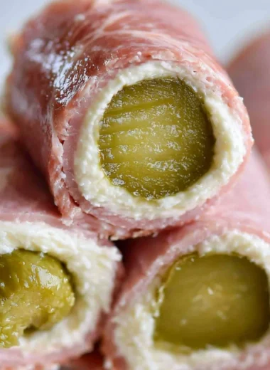 Delicious ham roll-ups with pickles and cream cheese ready to serve