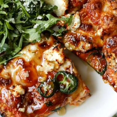 Hot Honey and Goat Cheese Pepperoni Pizza topped with spicy pepperoni and drizzled with honey