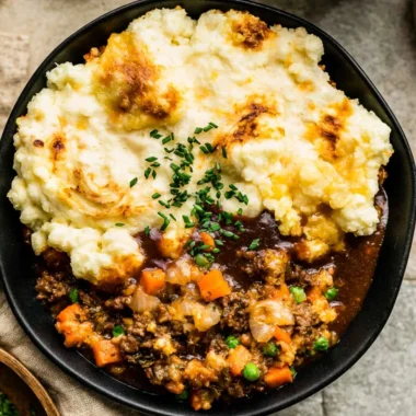 Delicious homemade Shepherd's Pie with golden mashed potatoes and savory meat filling.