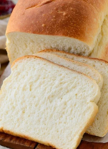 Homemade sourdough discard sandwich bread loaf on a wooden cutting board