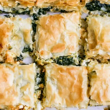 Delicious Spinach Pie served with a golden crust and fresh ingredients.