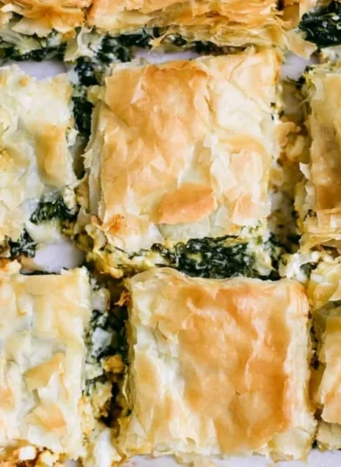 Delicious Spinach Pie served with a golden crust and fresh ingredients.