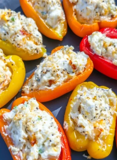 Delicious stuffed mini peppers served on a plate for a colorful appetizer.
