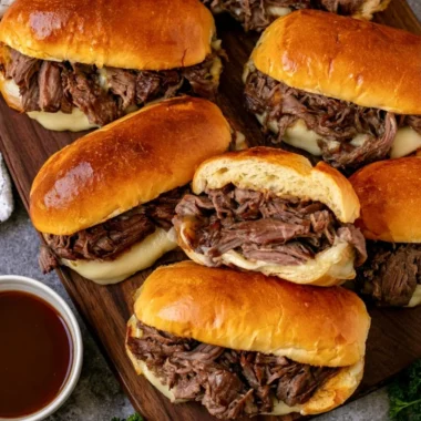 Delicious Crockpot French Dip Sandwiches served with au jus for dipping.