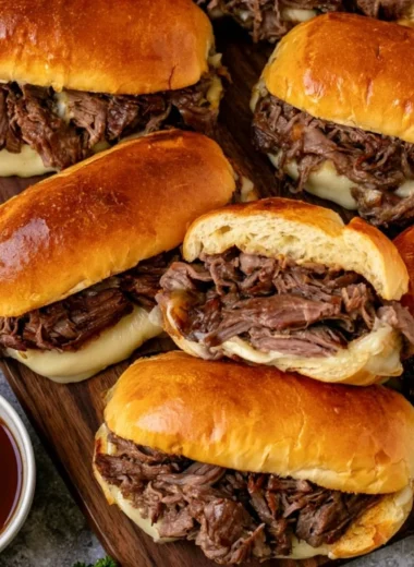 Delicious Crockpot French Dip Sandwiches served with au jus for dipping.